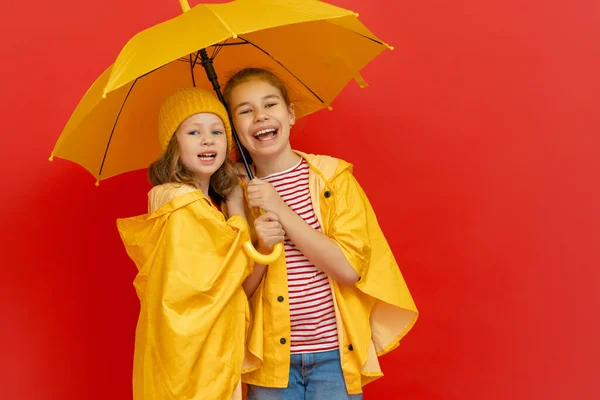 Happy Emotional Children Laughing Embracing Kids Yellow Umbrella Colored Red — Stock Photo, Image