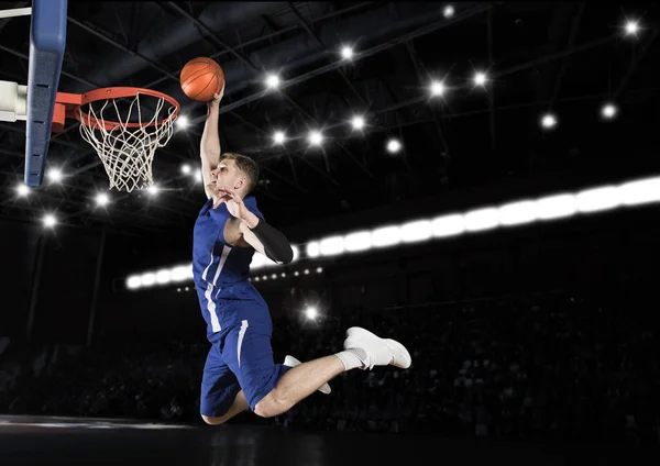 Basketball player in action in gym