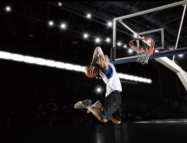 Basketball player in action in gym