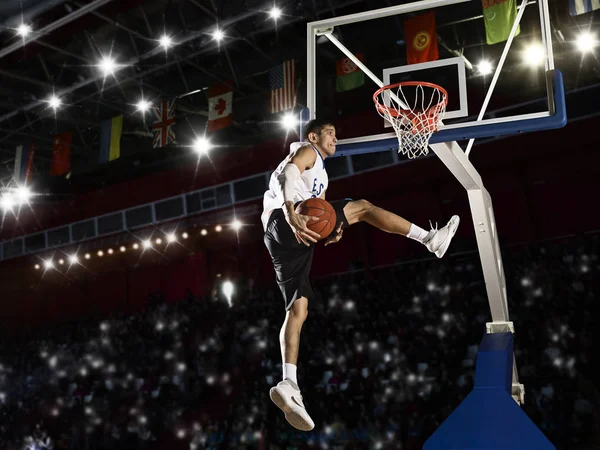 Basketball player in action in gym