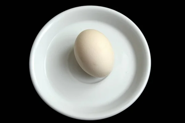 Close One Egg White Plate Isolated Black Background — Stock Photo, Image