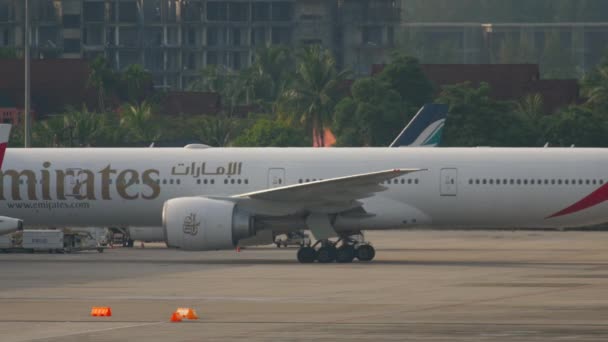 Widebody airplane taxiing on apron — Stock Video