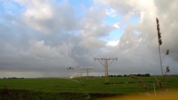 Airplane landing at illuminated runway — Stock Video