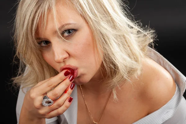 Blonde in a shirt with strawberries Royalty Free Stock Photos