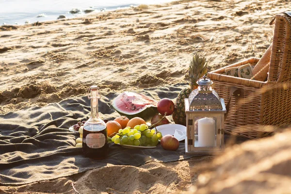 Picnic with Fruits and Wine on Plaid. Beach. Summer Concept