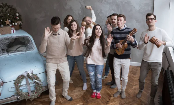 Funny Young People Sing a Song and Play. Christmas Concept