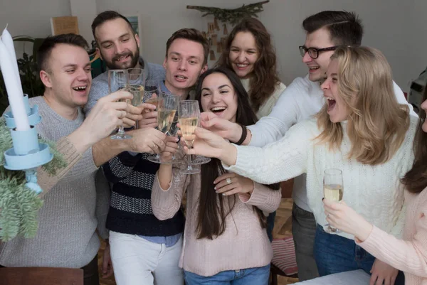 Young People with Glasses of Wine Celebrate. Winter Concept
