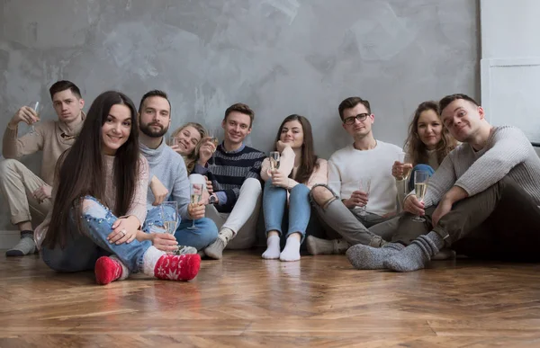 Young People with Glasses of Wine Celebrate. Winter Concept