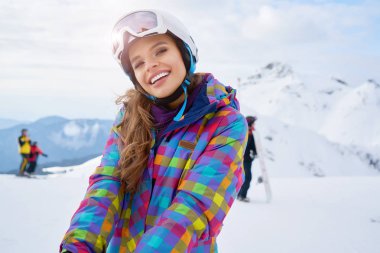              Close up portrait of a woman at a snow ski center.                   clipart
