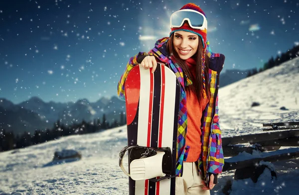 Sexy woman with snowboard outdoors — Stock Photo, Image