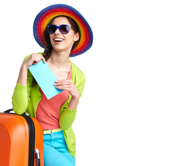 portrait of female tourist with travel suitcase and boarding pass