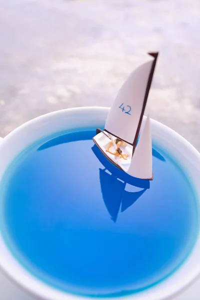 Dreams about holidays. the couple is sailing in a cup. miniature world