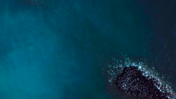 Top view of the surface of the Atlantic Ocean and breakwaters. Tenerife, Canary Islands, Spain — Stock Video