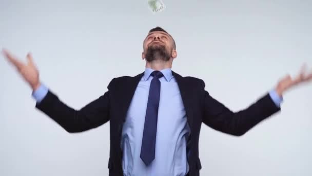 Slow motion of dollars falling on formally dressed man — Stock Video