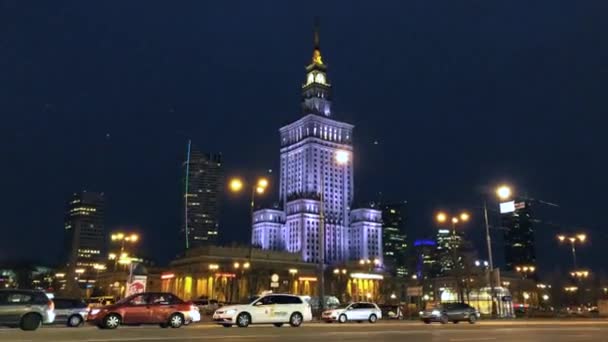 Night city traffic in the center of Warsaw near the Palace of Science and Culture, Poland. Time Lapse — Stock Video