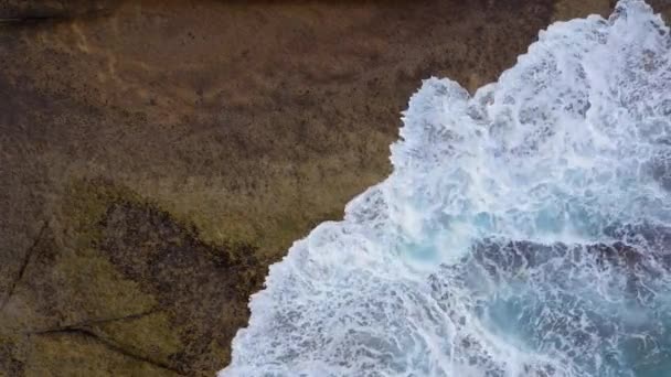 Top view of the desert stony coast on the Atlantic Ocean. Coast of the island of Tenerife. Aerial drone footage of sea waves reaching shore — Stock Video