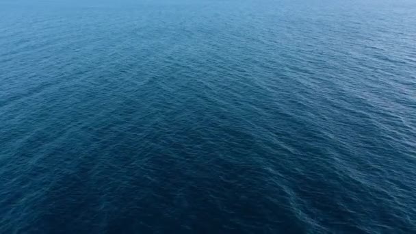 Flying over the blue surface of the sea or ocean — Stock Video