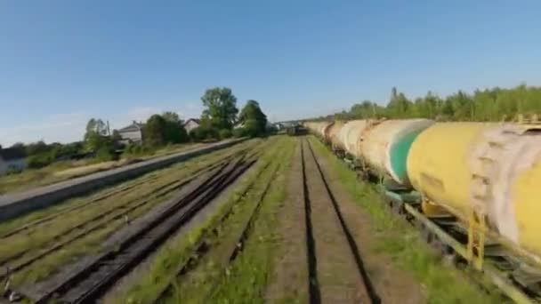 Fast and maneuverable flight along freight carriages. — Stock Video