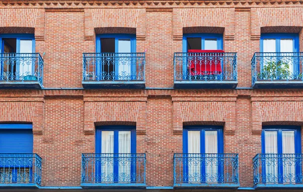 Background of a facade of old house with balconies in Madrid