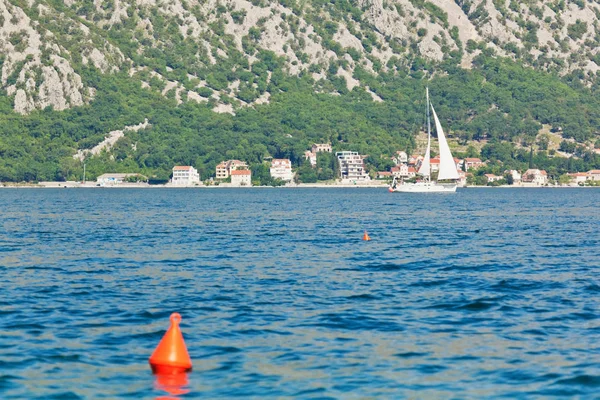 Amazing landscape view of the mountains and the sea and sailing yacht in Boka Kotor Bay, Montenegro