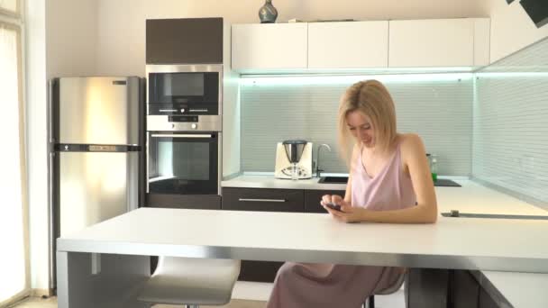Adult woman with phone at home — Stock Video