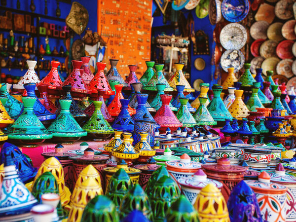 Colored Tajine, plates and pots out of clay on the market in Mor