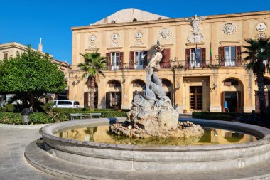 Fountain and Town Hall on a square near Cathedral. Monreale, Sicily, Italy
