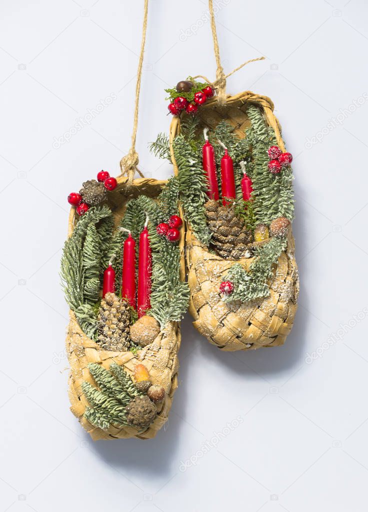 Russian Christmas decoration with bast shoes and candles