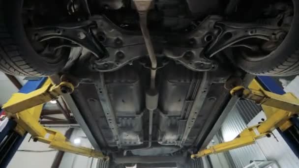 The bottom of the car. Garage service. Automobile diagnostic — Stock Video