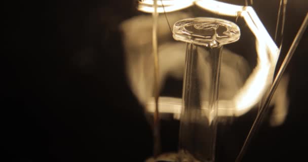 Close up light bulb. Filament gradually turns on and off — Stock Video