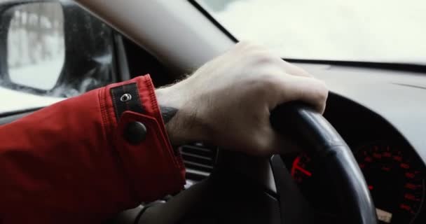 Closeup of person hands on steering wheel driving car. Man driving a vehicle. — Stock Video