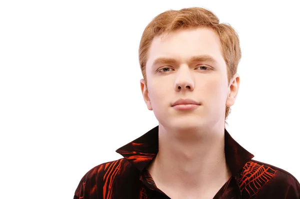 Red-haired young man close-up in a red shirt isolated on white background — Stock Photo, Image