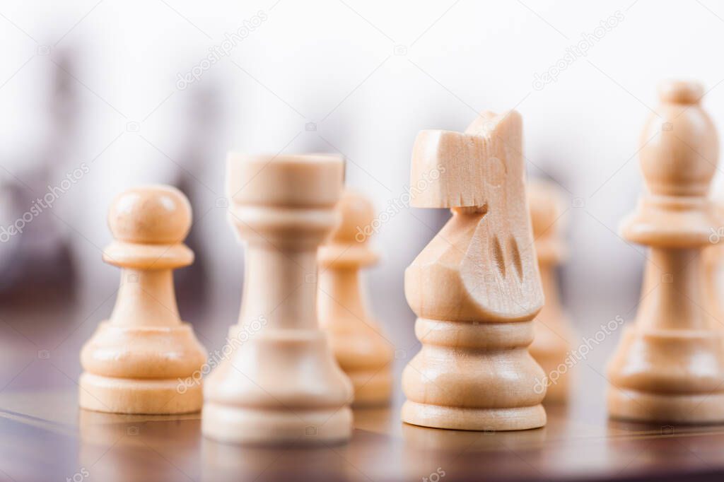 Chess board with white and black pieces.