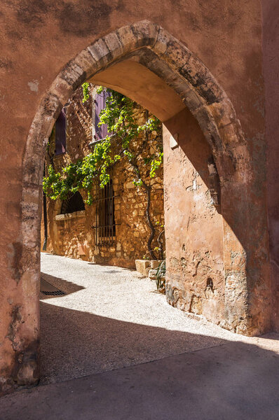 Street of medieval village of Roussillon. It ochre village is included in list of "The most beautiful villages of France"
