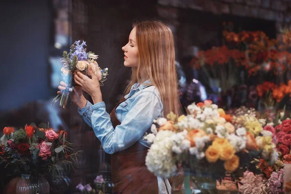 Young florist at work in the store