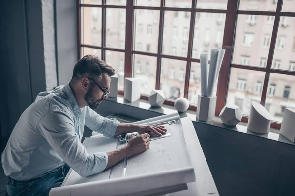 Young man with glasses in the workplace