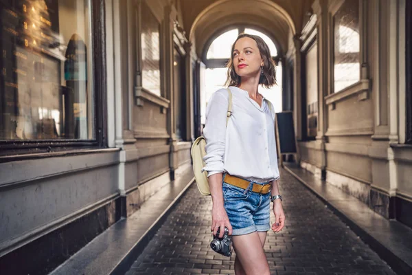 Attractive girl with a retro camera — Stock Photo, Image