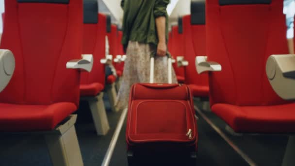 Young woman with a red suitcase — Stock Video