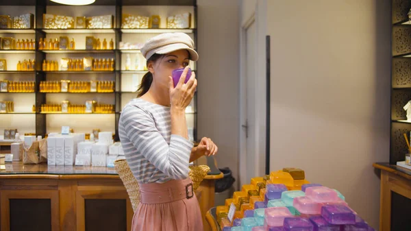 Young european woman in a perfume shop, Paris