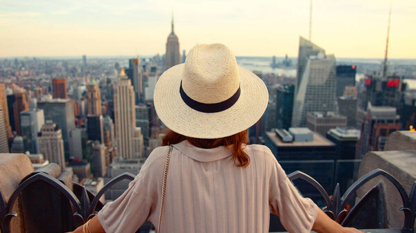 Attractive girl in a hat at viewpoint in New York
