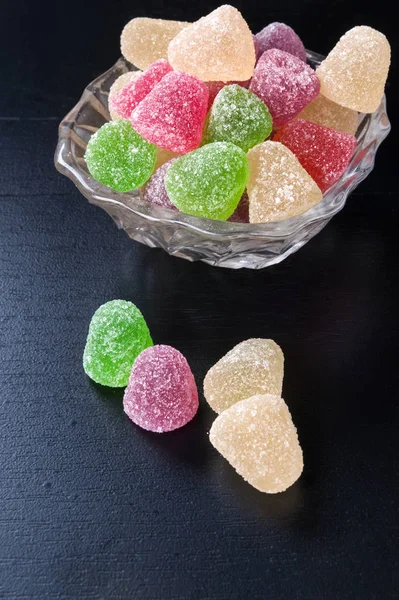 Sweet marmalade candy jelly on dark — Stock Photo, Image