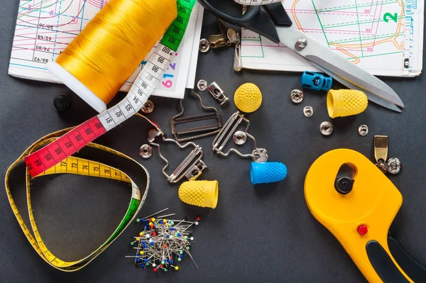 Sewing measuring tape with sewing patterns — Stock Photo, Image