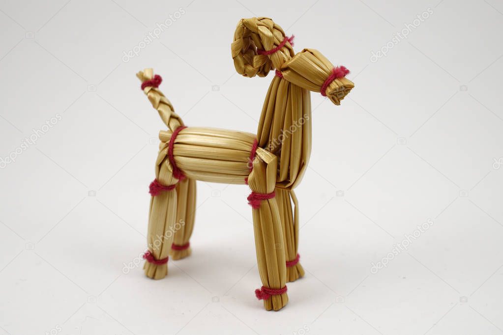 traditional christmas straw goat on white background
