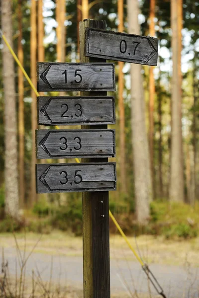 Wooden signs of directions and distances — Stock Photo, Image