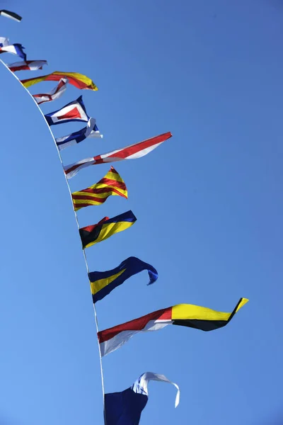 Sea flags fluttering in the wind — стоковое фото