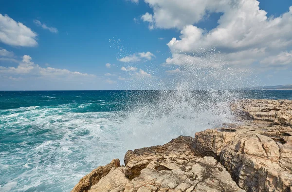 stock image Big waves break about the Rocky Peninsula of Cape Lara in southern Akamas, Cyprus