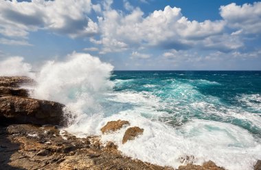 Waves beat on the rocky shore, Mediterranean Sea. Cyprus clipart
