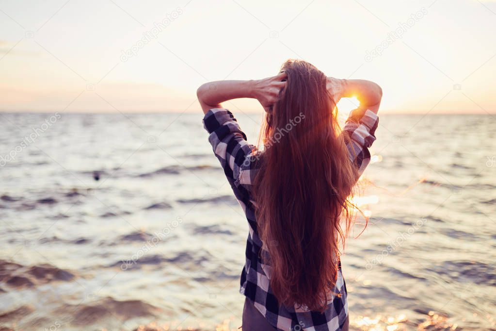Portrait of young beautiful woman in sunset light