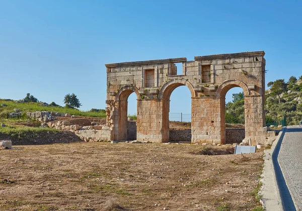 The well preserved ancient triple arched Triumphal Arch located at the entrance to the Patara ancient city, Turkey