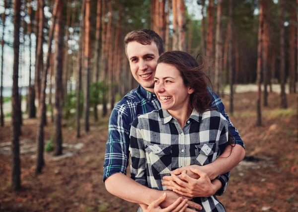 Young couple smiling at each other during a romantic date in the — Stock Photo, Image